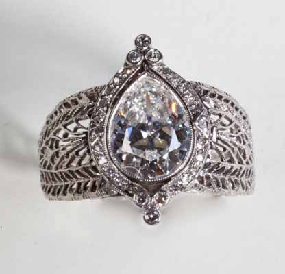 antique platinum diamond ring 2 carat pear shape in center. Nobel jewelry store, Santa Monica.