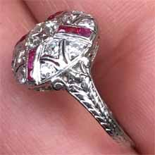 Platinum, french cut rubies and diamond Art Deco ring, Circa 1920s, total 1 Carat